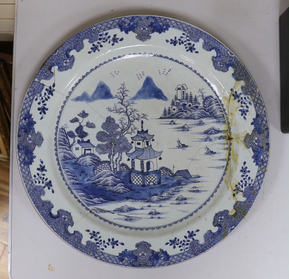 An 18th century Chinese export blue and white charger a.f., 55cms diameter